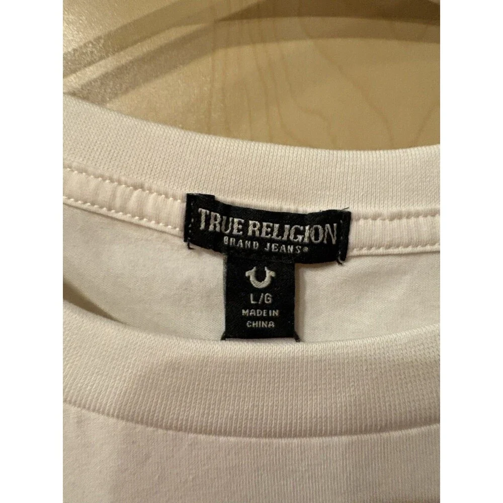True Religion t-shirt features a pink bandana-printed horseshoe logo